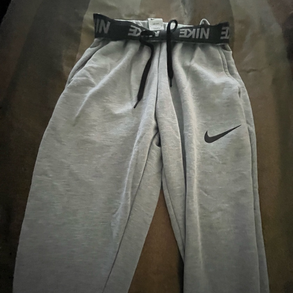 nike grey sweat pants black nike band